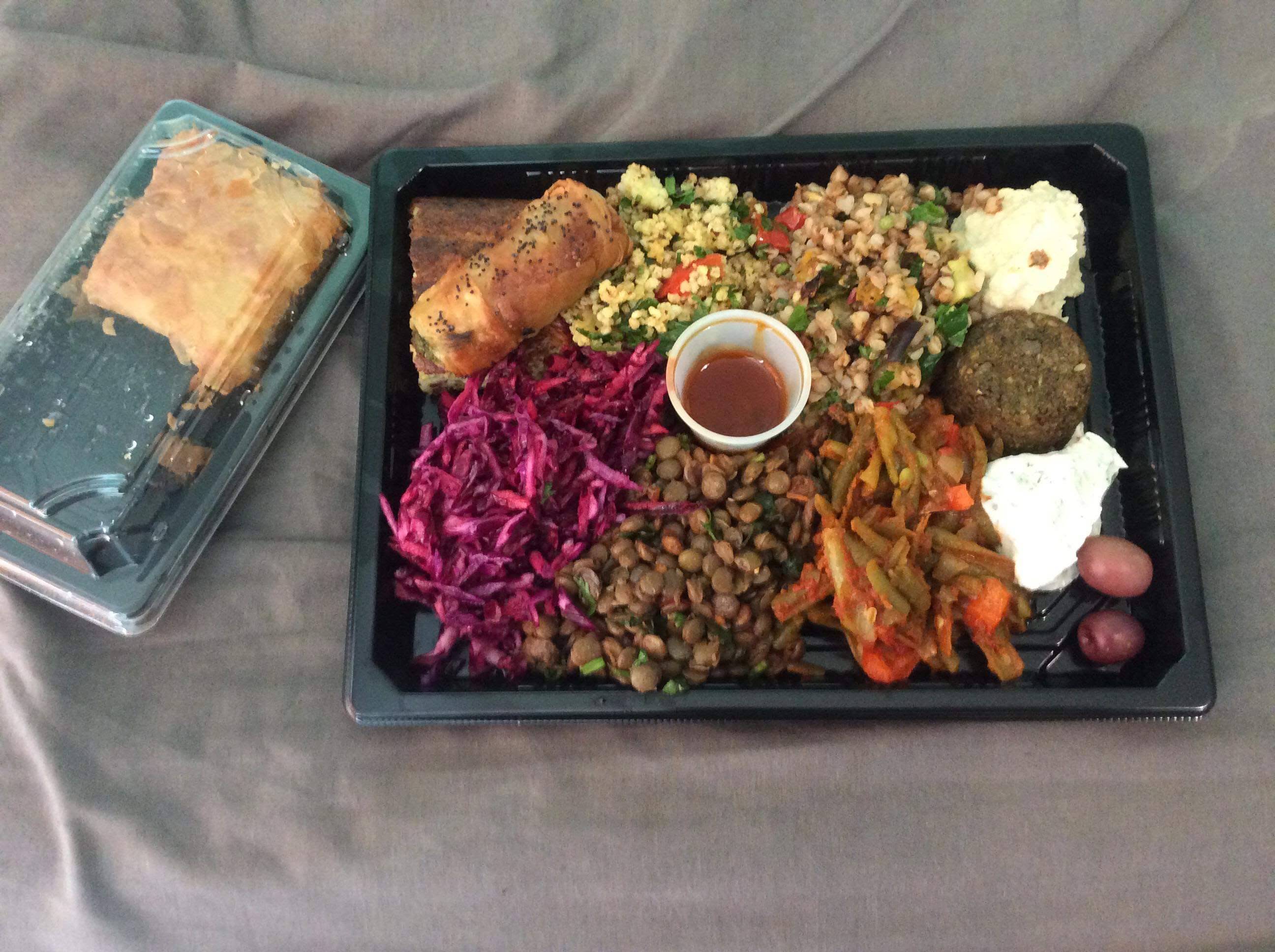 A complete Sunbirds meze tray with colourful salads, dips and a pastry alongside